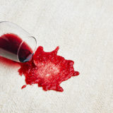 Red Wine Glass Spilled on White Carpet