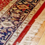 Red Oriental Rug with White Fringe